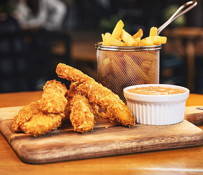 Fried chicken and chips with sauce served at Chicken and Pizza Valley, the best Chicken Restaurant and Takeaway in Swindon!